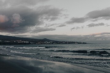 Fototapeta premium View of the seawater waves under the cloudy sky.