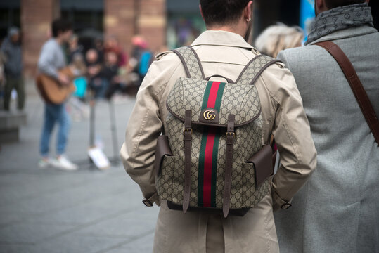 Strasbourg - France - 8 April 2023 - closeup of man wearing a gucci backpack in the street