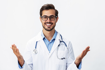 A man doctor in a white coat and eyeglasses with a smile with teeth on a white isolated background looking into the camera, copy space, text space, health