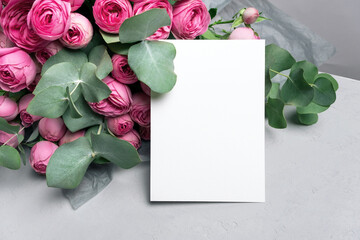 Wedding invitation card mockup with fresh roses flowers and eucalyptus, blank mockup