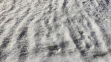 Snow relief wavy texture background. Abstract winter landscape and concept of cold and frozing time. Black and white colors