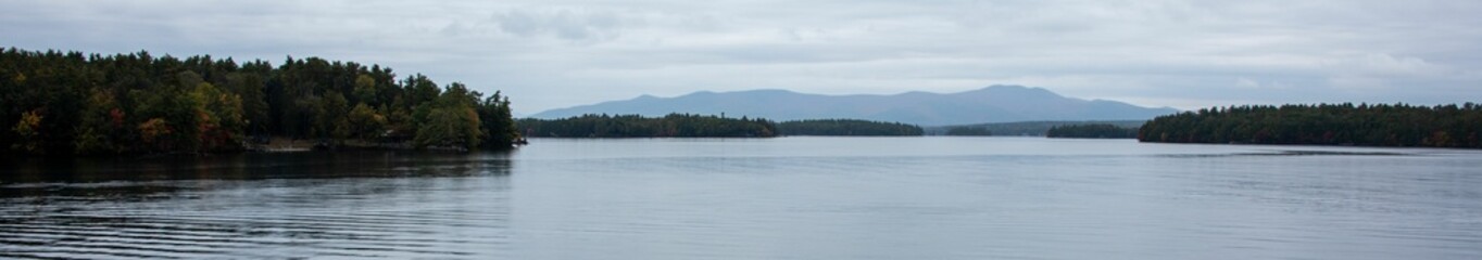 Fototapeta na wymiar Panoramic shot of a tranquil lake landscape in New Hampshire