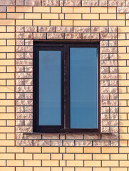 Window in the brick wall of the house. Background