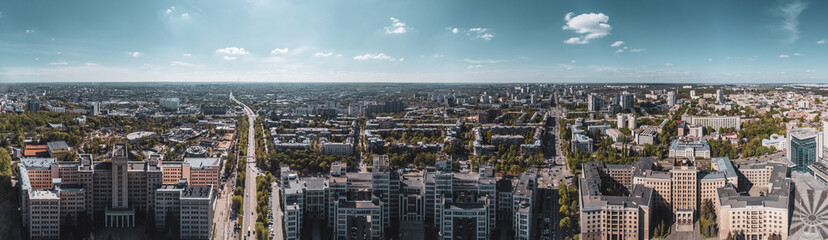 Aerial panorama on Derzhprom and Karazin National University buildings on Freedom Square with blue sunny sky in Kharkiv, Ukraine