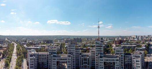 Aerial panorama on Derzhprom building with blue sky cloudscape in spring Kharkiv city center, Ukraine. Constructivist architecture style