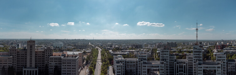 Aerial panorama view on street between Karazin National University and Derzhprom with cars driving to Freedom Square in sunny Kharkiv, Ukraine