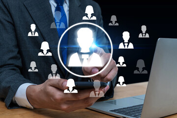 Naklejka premium Job Interview. HR management hand using mobile smart phone find employee with virtual graphic icon diagram, team leader, business marketing, job recruitment, human resource management concept