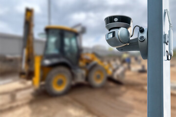 CCTV camera watching an excavator and workers working on a construction site.