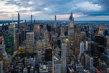 Fototapeta na wymiar An illuminated midtown of New York City and rainy clouds above.