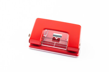 Red paper hole puncher, isolated on white background.