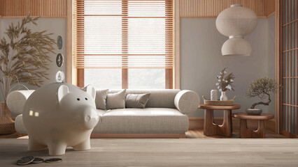 Wooden table top or shelf with white piggy bank with coins, minimalist wooden living room with sofa, expensive home interior design, renovation restructuring concept architecture