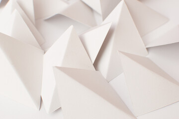 Close up of white 3d triangle shapes on white background