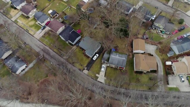 Drone of suburban Cuyahoga Valley Ohio during cold winter - top down of mid west neighborhood