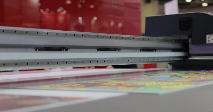 Modern Digital Large format UV printer. Printing production technologies. UV pinning is the process of applying a dose of low intensity ultraviolet light to a UV curable ink