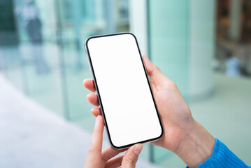 Hand holding smartphone mockup of blank screen, Take your screen to put on advertising.