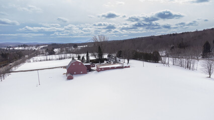 Flight over a farm in the Canadian countryside in Estrie, Quebec.