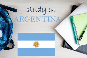 Study in Argentina. Background with notepad, laptop and backpack. Education concept.