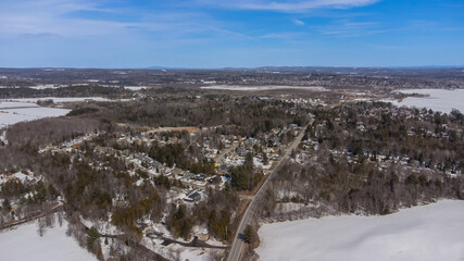 Aerial view of part of the city of Magog in Quebec, Canada, with its river.