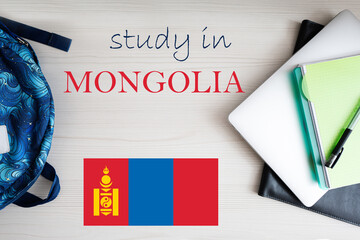 Study in Mongolia. Background with notepad, laptop and backpack. Education concept.