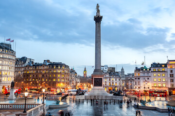 Nelson's Column is in the center of the square, flanked by fountains. At the top of the column is a...