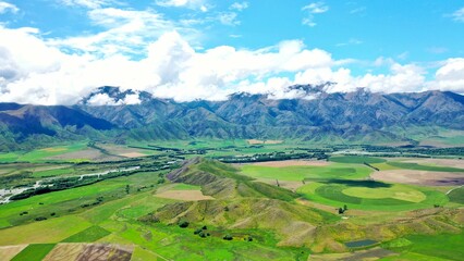 Fototapeta premium Beautiful aerial view of green mountainous landscape in summertime on daytime
