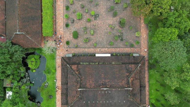 Aerial drone footage above the compound of Thien Mu pagoda near Hue in central Vietnam. Camera looks down and fowards above the complex 3-3