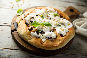 Homemade pizza with fresh cheese