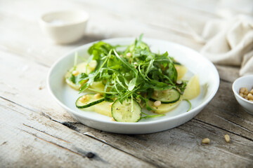 Potato salad with cucumber and arugula