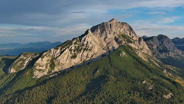 Aerial around view of Maglic Mountain in National park Sutjeska. The highest mountain of Bosnia and Herzegovina, beautiful landscape at sunset, 4k