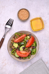 Salad slices of raw vegetables with lentils