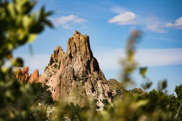 High rocky mountain peak under the blue sky on a sunny day