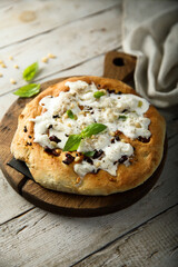 Homemade pizza with fresh cheese