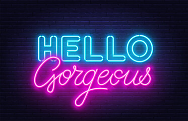 Hello Gorgeous neon quote on brick wall background. © TanyaFox