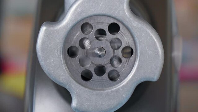 Electric mincer machine for minced meat per minute, make sausages, mashed berries, squeeze juice. Close up