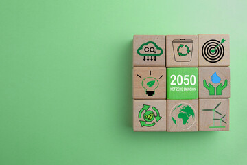 Net Zero Emission in 2050,Carbon neutral concept.,Wooden cubes with Net Zero Emission icon over...