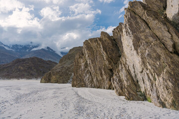 beautiful scenery trail up the rocky mountain, the background is cloudy sky at sunset