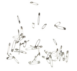 Safety Pin brooch pour fall down, explosion in air. Many safety pin medium size splash fly in group floating. White background isolated high speed shutter freeze motion