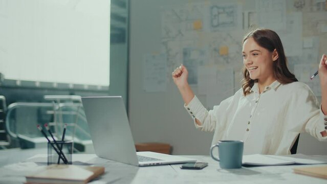 Confident Female Engineer is Typing on a Laptop Computer, Working Online on a New Project. Motivated Female Manager is Doing a New Project. Engineering and Creativity New Product Development