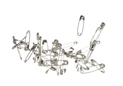 Safety Pin brooch pour fall down, explosion in air. Many safety pin medium size splash fly in group floating. White background isolated high speed shutter freeze motion