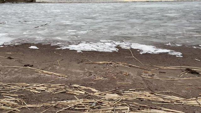 Cold and cloudy spring day at Malar lake or near the Baltic sea. Beach. Great nature and seascape. Stockholm, Sweden, April 2023.