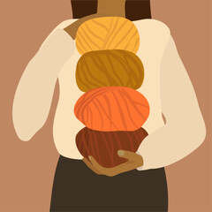 The woman with coloured knitted wool. Warm autumn colours.