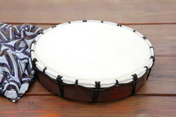 Modern drum on wooden table. Musical instrument