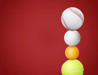 Stack of different sport balls on red background, space for text