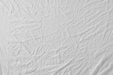 Crumpled white fabric as background, top view