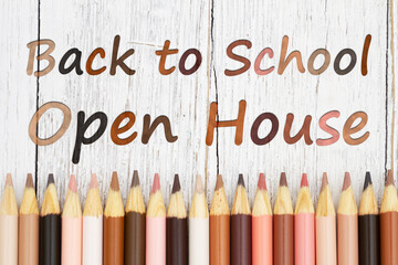 Back to school open house message with multiculture skin tone color pencils