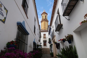 Cozy street with a church in the Spanish town of Estepona