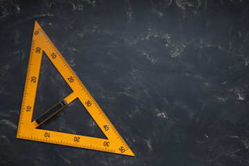 Triangle with measuring length markings on blackboard, top view. Space for text