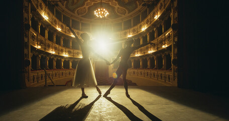 Cinematic shot of Young Couple of Classical Ballet Dancers Performing on the Stage of Classic...