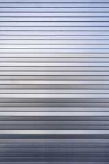 Obraz premium close up of a closed metal shutter at a warehouse as background