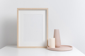 Black picture frame mockup in white interior with copy space for photo or print, blank frame mockup